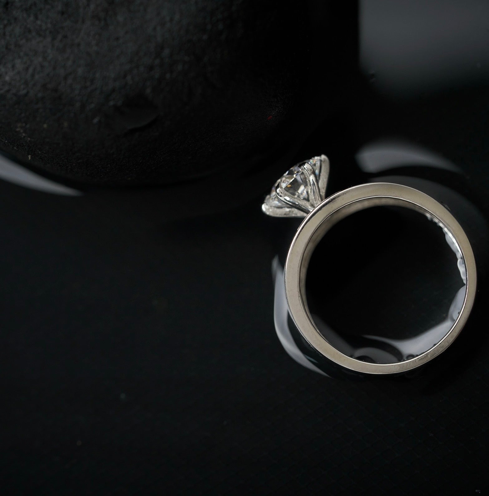 moissanite-solitaire-ring-black-background-lbluxebrilliance
